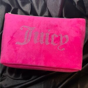 NWT Juicy Couture Make Up bag. Bright pink with Juicy bling on one side.